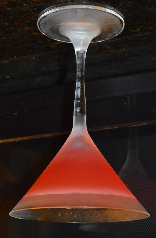 An upside-down picture of a cosmopolitan made with Hangar One Mandarine Blossom Vodka.  Notice how it doesn't spill. ;)